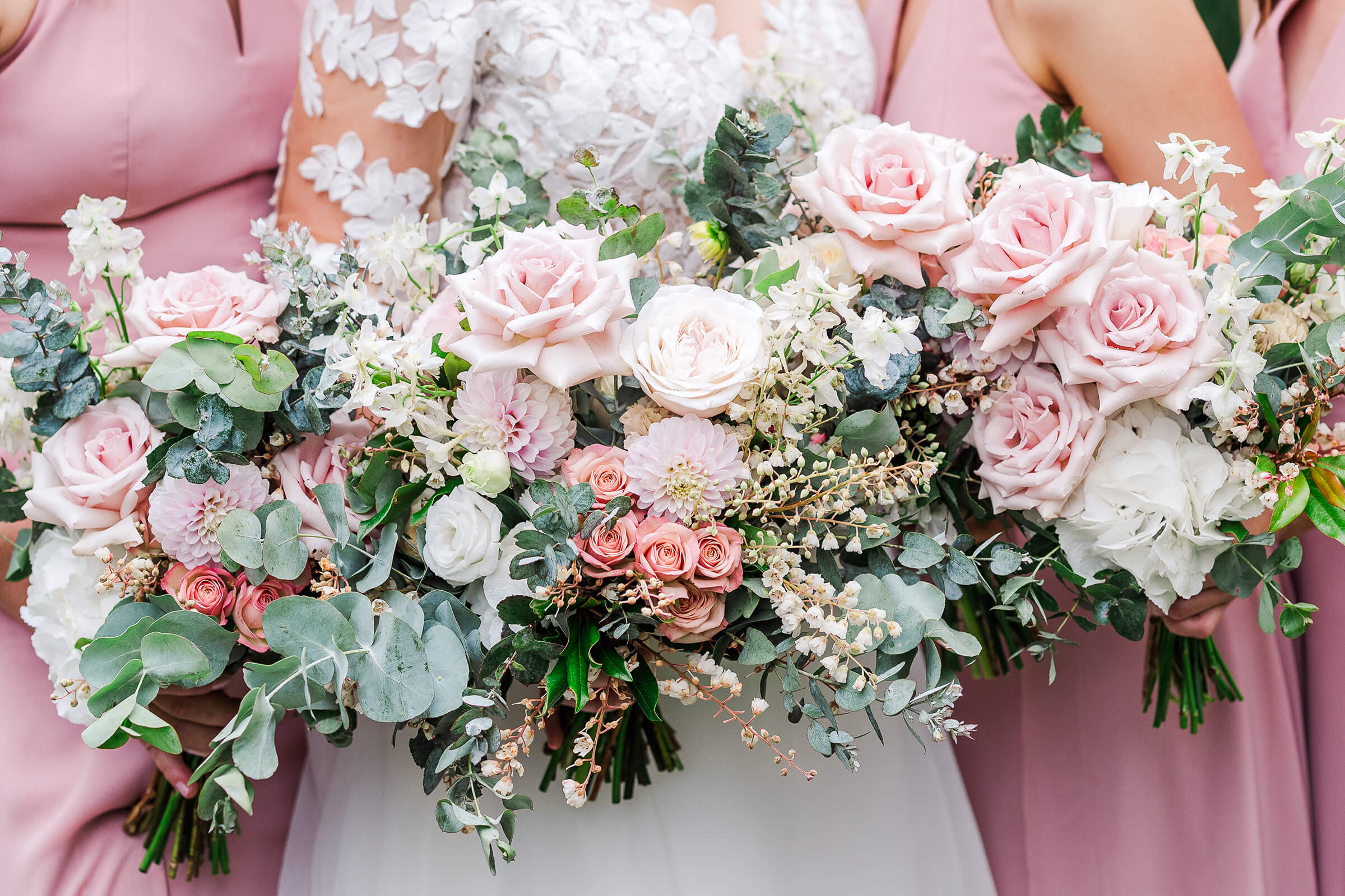 wedding bouquets of pinks and eucalyptus flowers