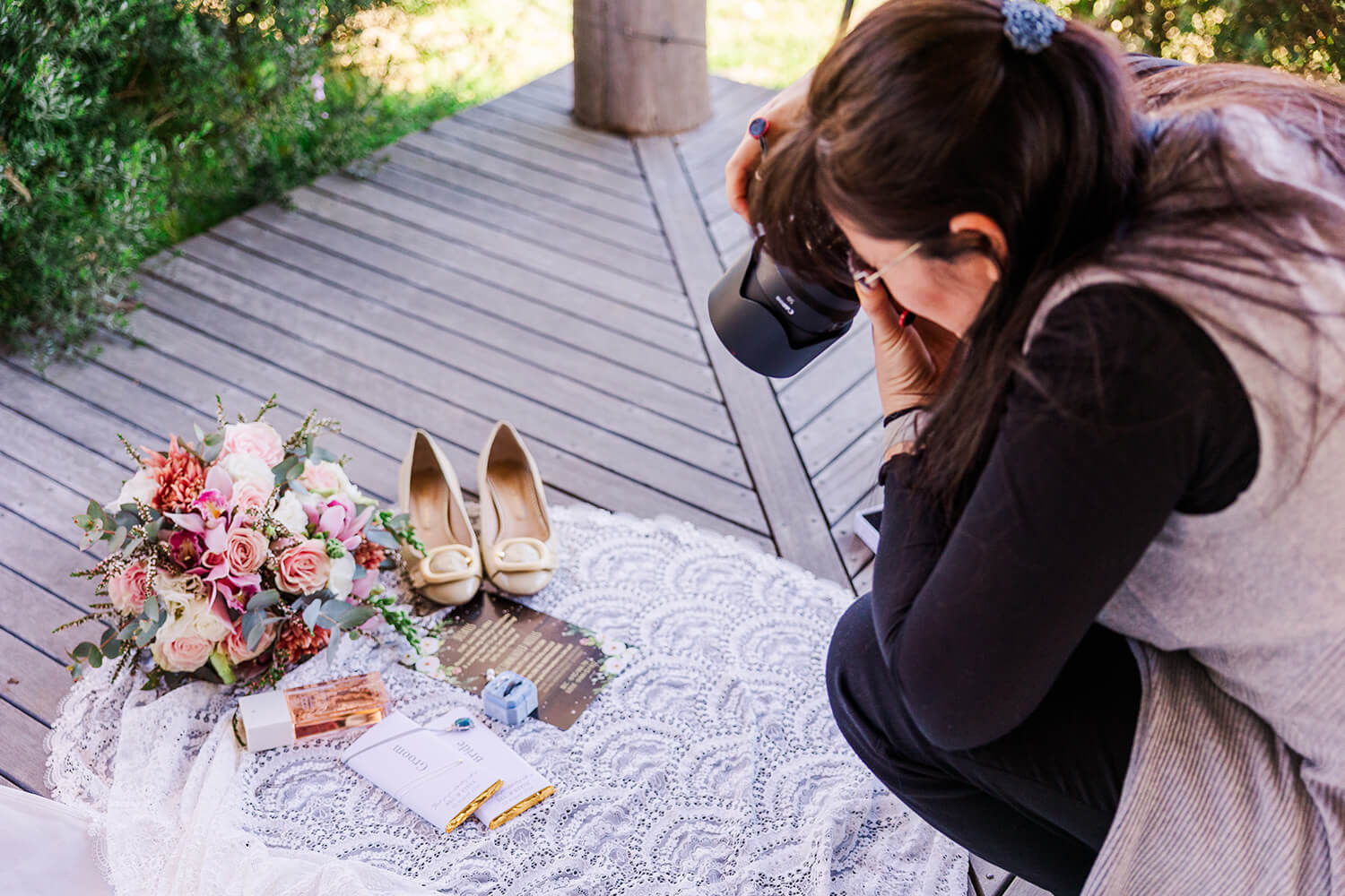 wedding photographer on a canon 50mm 1.2 shooting wedding bridal details